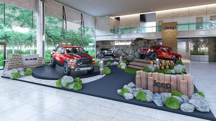 Triển lãm xe Jeep và RAM trong không gian nội thất hiện đại với tiểu cảnh thiên nhiên.