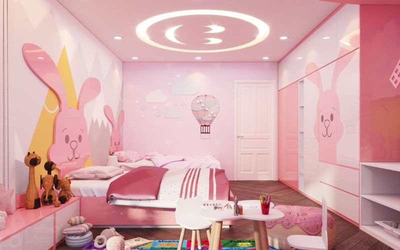 Phòng ngủ trẻ em màu hồng với họa tiết thỏ dễ thương và không gian trang trí sáng tạo.