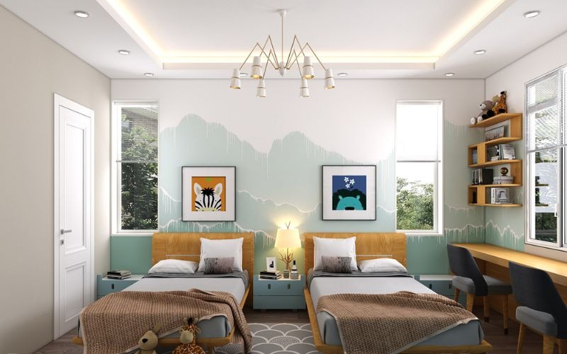 Phòng ngủ đôi với giường gỗ, tranh treo tường, bàn học và đèn trần hiện đại.