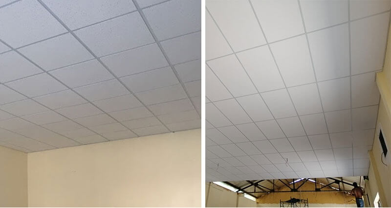 Trần thạch cao trắng, thiết kế ô vuông, trong nhà sáng sủa. Phù hợp cho văn phòng, phòng khách hoặc không gian rộng.