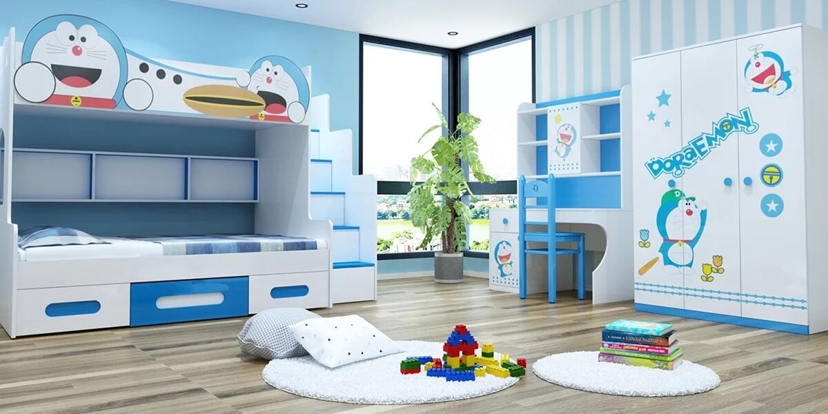 Phòng ngủ trẻ em chủ đề Doraemon với giường tầng, bàn học và tủ đồ màu xanh trắng.