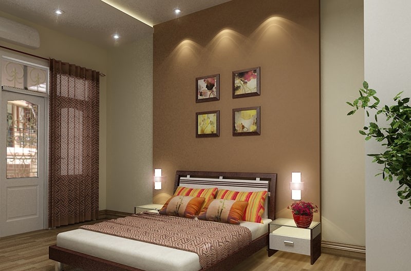 Phòng ngủ hiện đại với tông màu nâu, giường đôi, đèn ngủ và tranh treo tường, tạo không gian ấm cúng và thư giãn.