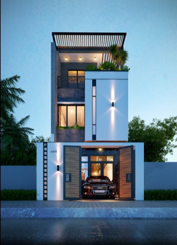 Nhà phố ba tầng hiện đại với gara ô tô, thiết kế tối giản và sân vườn trên mái, ánh sáng buổi tối lung linh.