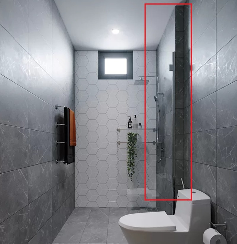 Nhà vệ sinh hiện đại với gạch lục giác, vòi sen, toilet và kệ trang trí cây xanh.