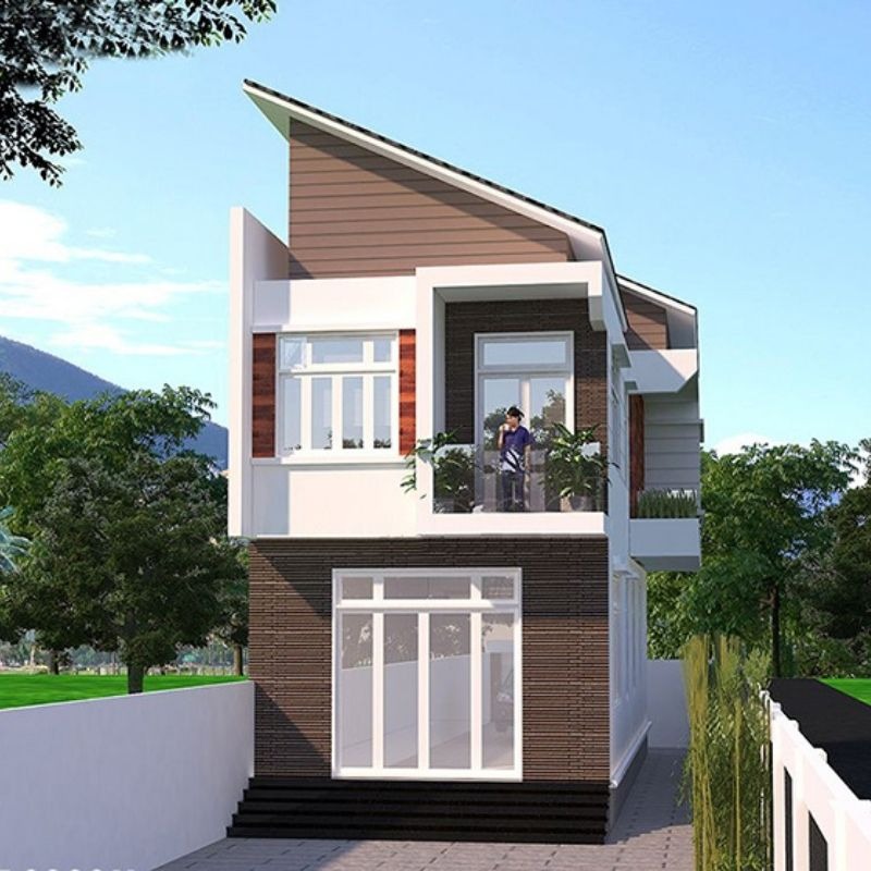 vat-lieu-xay-dung Nhà hai tầng hiện đại với ban công, cửa kính lớn, cây xanh xung quanh và mái dốc, nằm dưới bầu trời trong xanh.