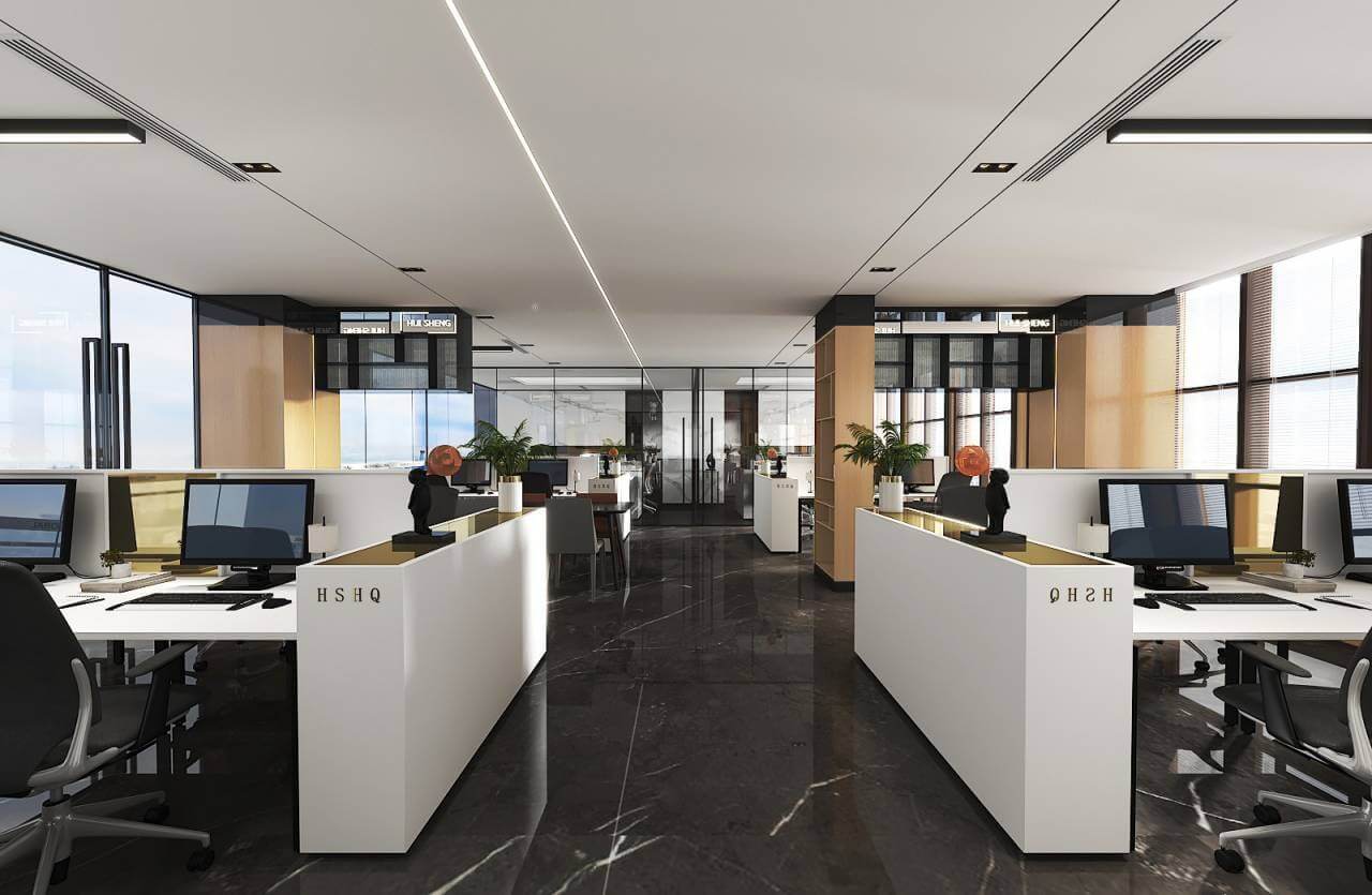 Văn phòng hiện đại với nội thất sáng, máy tính để bàn, không gian làm việc mở và cây xanh trang trí.