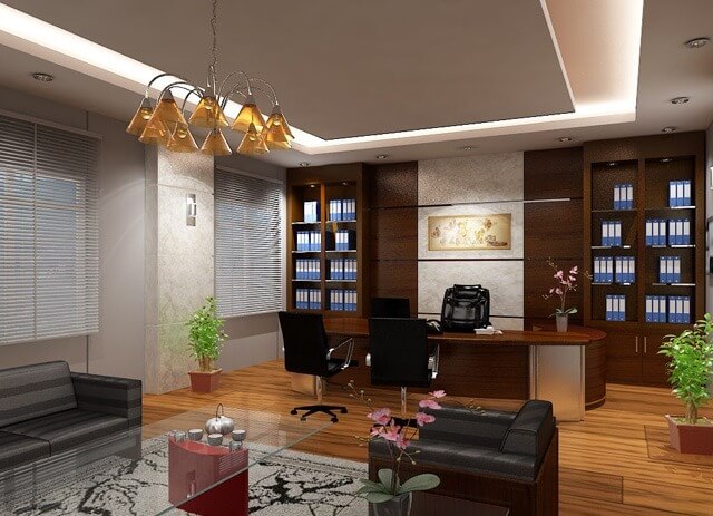 vi-tri-dat-sofa-tiep-khach Văn phòng sang trọng với bàn ghế hiện đại, cây xanh và đèn trang trí, tạo không gian làm việc thoải mái.