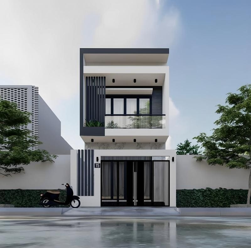 Nhà phố hiện đại hai tầng với cửa kính lớn và cây xanh xung quanh, bên ngoài có xe máy đỗ gần cổng.