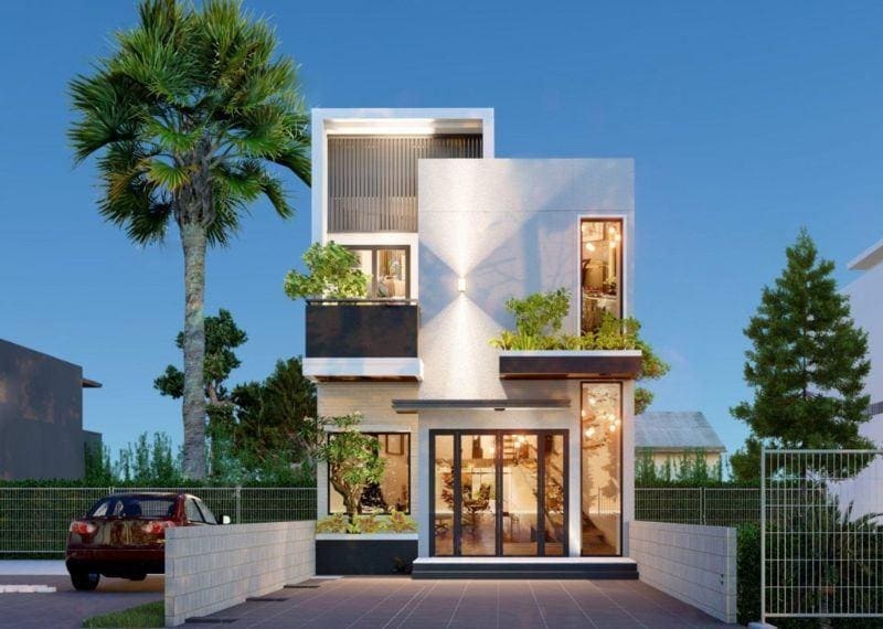 Nhà phố hiện đại 3 tầng với cây xanh và ánh sáng tự nhiên, mặt tiền thoáng đãng giữa trời xanh.