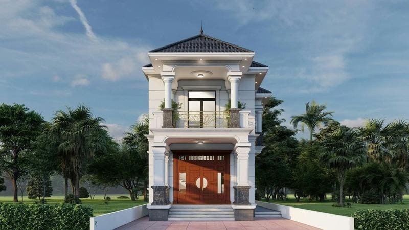 Nhà hai tầng hiện đại với mái ngói và cột trụ, nằm giữa vườn cây xanh tươi, bầu trời trong xanh.