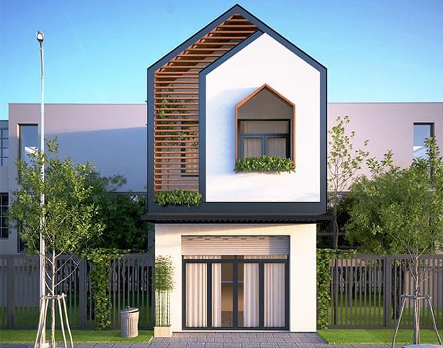 Nhà phố hiện đại hai tầng với thiết kế mái dốc, cây xanh và cửa kính lớn, phong cách tối giản.