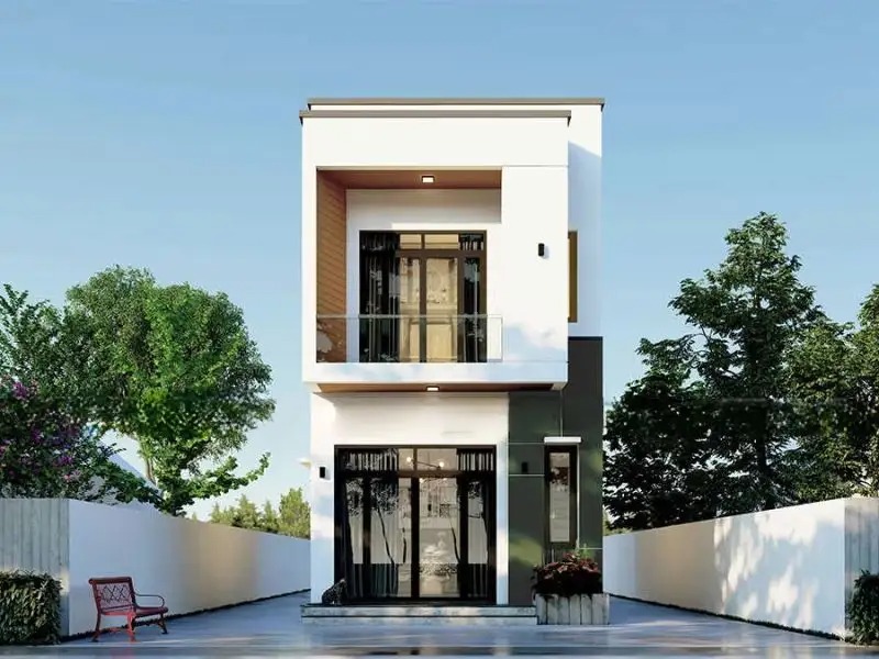 Nhà phố hiện đại hai tầng với cửa kính lớn, cây xanh và hàng rào trắng bao quanh.